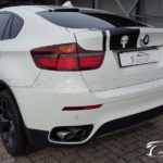 BMW X6 xDrive35d E71 - reequipamiento sonido activo - vista posterior lateral